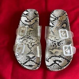 Ccocci black/ white sandals with 2 clear straps with buckles. Size 7